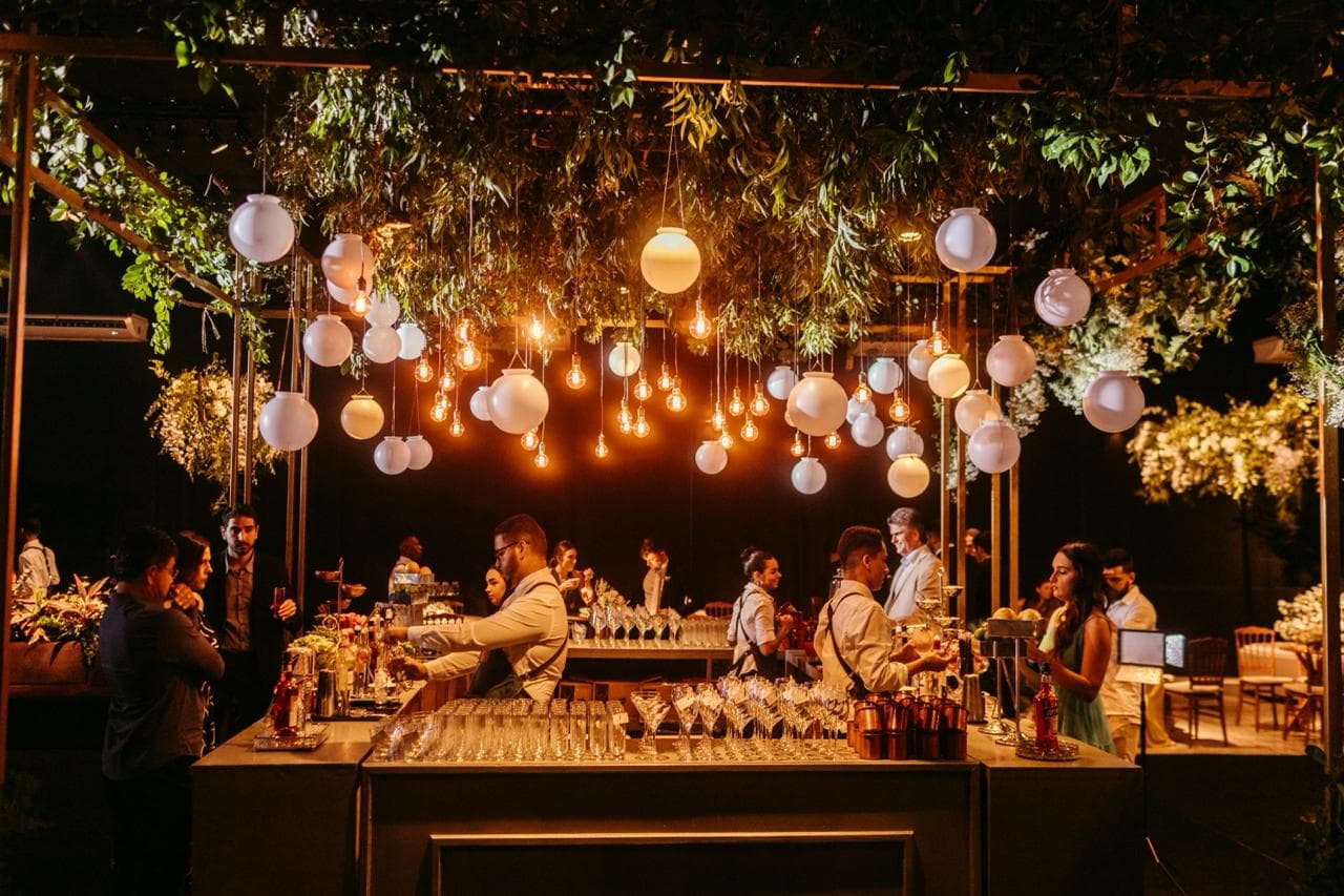 Elegant evening reception with hanging lights and guests.